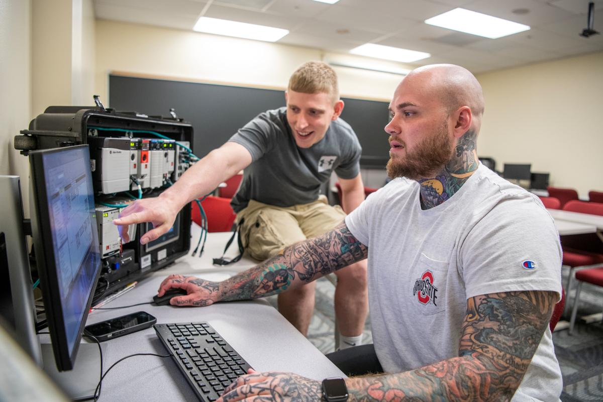 Two men working on a computer