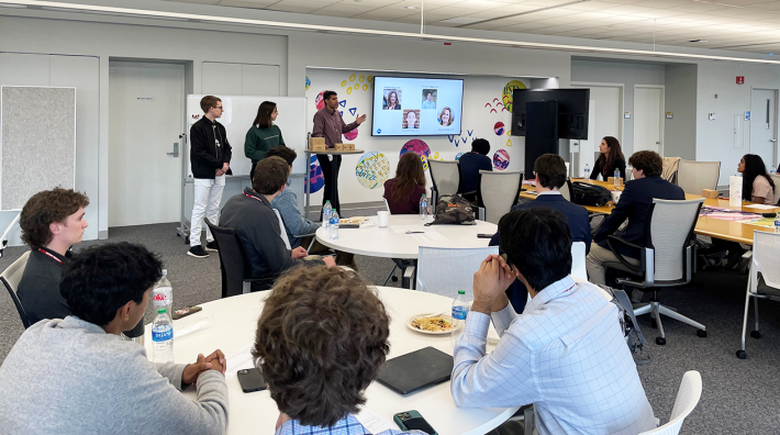 Picture of college students presenting in a classroom