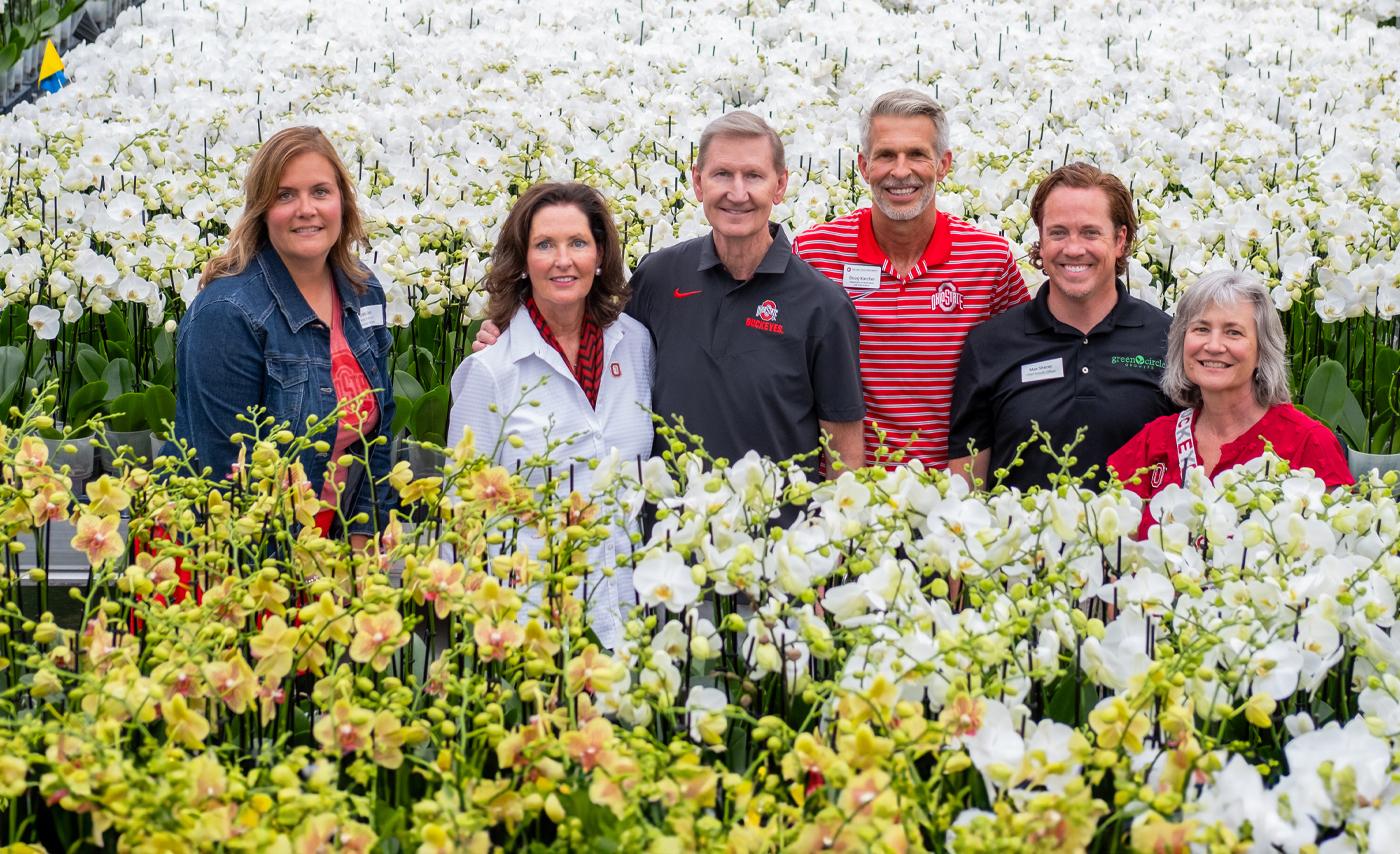 Group of people in a florist greenhouse