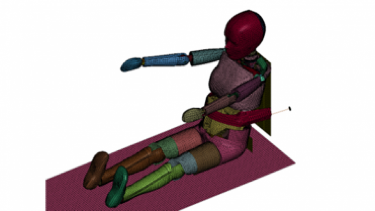 A digital model of a human sitting on the ground with arms extended.